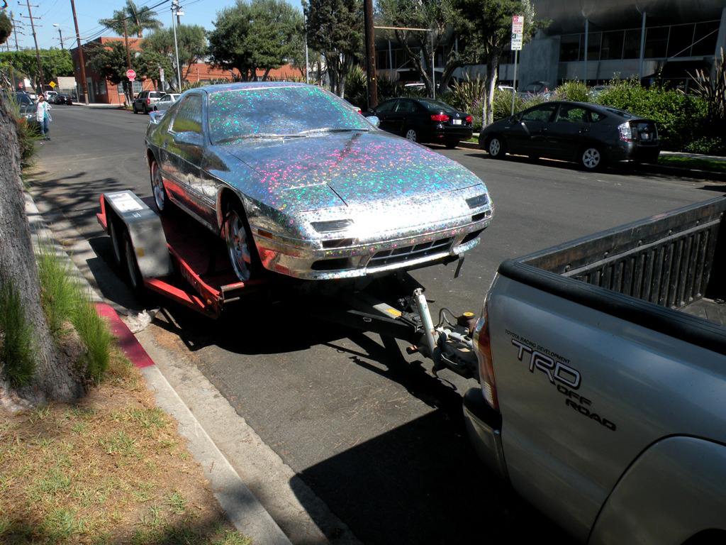 RX-Heaven by Ichiro Irie (2012). Holographic film on Mazda RX7. Dimensions variable. Photo courtesy of artist.